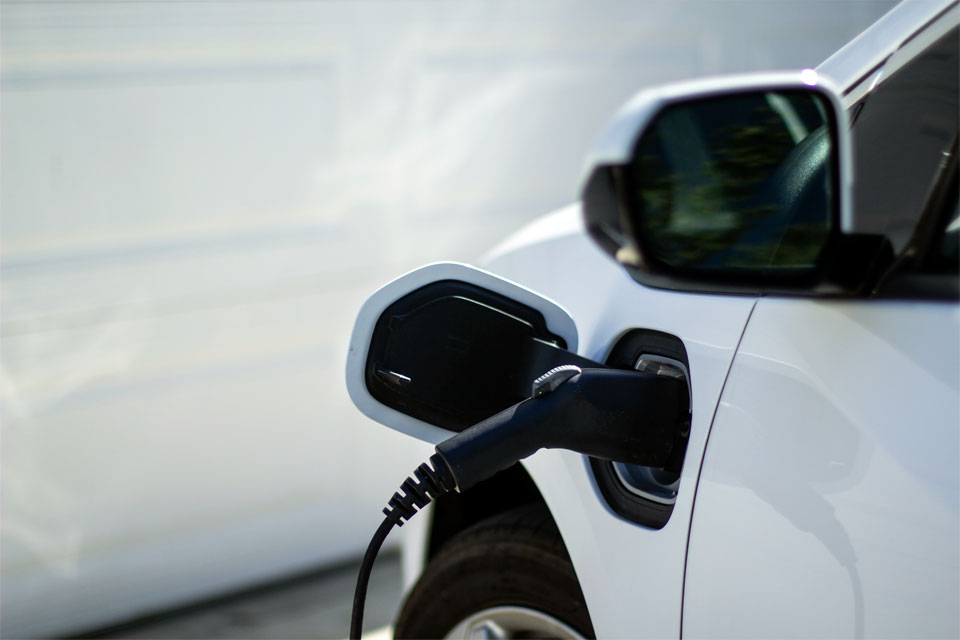 Image of an electric vehicle charging in a garage