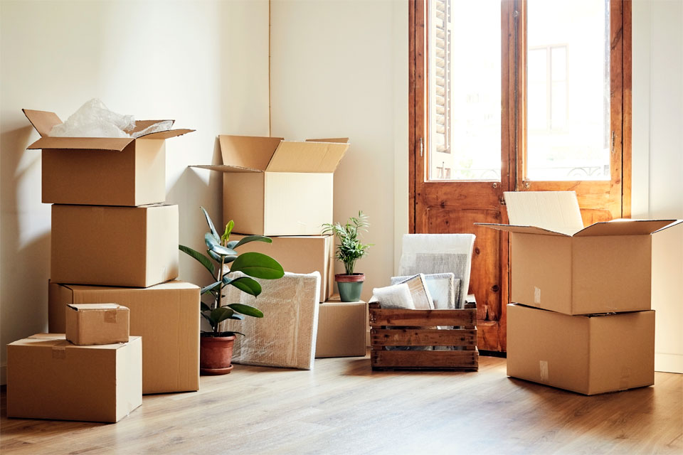 Image of a room with packed boxes ready to move out