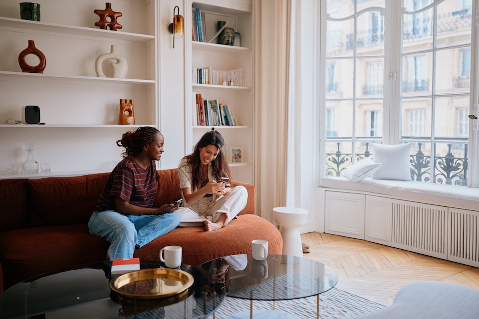Image of two people in an apartment building